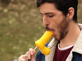 Guy sucking a dick shaped ice cream at the park